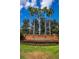 Inviting Glenmuir community entrance sign surrounded by manicured landscaping and lush greenery at 6550 Crestmont Glen Ln, Windermere, FL 34786