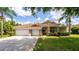 Charming single-story home with a three-car garage and well-manicured lawn at 6550 Crestmont Glen Ln, Windermere, FL 34786
