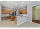 Open concept kitchen with stainless steel appliances and spacious center island at 6550 Crestmont Glen Ln, Windermere, FL 34786
