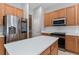 Updated kitchen with stainless steel appliances and a large center island at 6550 Crestmont Glen Ln, Windermere, FL 34786