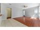 Spacious living room with hardwood and tile flooring, bright lighting, and ample space at 6550 Crestmont Glen Ln, Windermere, FL 34786