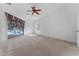 Spacious main bedroom features carpet floors, fan, and sliding doors to the outside at 6550 Crestmont Glen Ln, Windermere, FL 34786