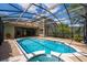 Backyard with a screened-in pool and spa, offering a relaxing oasis at 6550 Crestmont Glen Ln, Windermere, FL 34786