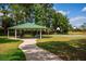 Shaded gazebo with picnic tables beside a basketball court providing outdoor recreation in a park-like setting at 6550 Crestmont Glen Ln, Windermere, FL 34786