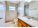 This bathroom features a tiled shower and a single sink vanity at 7700 Greytwig Ln, Orlando, FL 32818