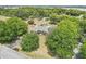 Sprawling single-story home with a pool, large yard, mature trees, and close to a lake at 7779 Lake Andrea Cir, Mount Dora, FL 32757