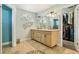 Bright bathroom features a double vanity with granite counters and walk-in closet at 7779 Lake Andrea Cir, Mount Dora, FL 32757