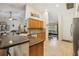 Open kitchen featuring ample countertop space, tiled floors, and views to other rooms at 7779 Lake Andrea Cir, Mount Dora, FL 32757