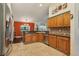 Bright kitchen with stainless steel appliances and view to the dining room at 7779 Lake Andrea Cir, Mount Dora, FL 32757