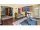 Inviting living room with hardwood floors and natural light coming through the windows at 7779 Lake Andrea Cir, Mount Dora, FL 32757