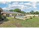 Backyard pool view with a spa, and partially fenced yard, all ready for entertaining and relaxation at 7779 Lake Andrea Cir, Mount Dora, FL 32757