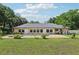 Backyard view of a lovely private pool and patio, perfect for relaxing or entertaining guests at home at 7779 Lake Andrea Cir, Mount Dora, FL 32757