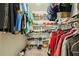 Organized walk-in closet with shelves, hanging rods, and plenty of storage space at 7779 Lake Andrea Cir, Mount Dora, FL 32757