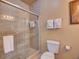 Bright bathroom featuring a tiled shower, well-placed towel racks, and neutral decor at 8000 Tuscany Way # 4408, Davenport, FL 33896