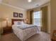 Cozy bedroom with a plush bed, neutral tones, and ample natural light at 8000 Tuscany Way # 4408, Davenport, FL 33896