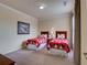 Charming bedroom featuring twin beds with Mickey Mouse bedding and neutral color scheme at 8000 Tuscany Way # 4408, Davenport, FL 33896