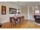 Dining room with seating for six flowing into living room at 8000 Tuscany Way # 4408, Davenport, FL 33896