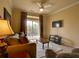Comfortable living room with neutral decor, a balcony view, and a mounted television at 8000 Tuscany Way # 4408, Davenport, FL 33896