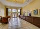 Beautifully decorated lobby features elegant tile flooring, seating and a reception desk at 8000 Tuscany Way # 4408, Davenport, FL 33896