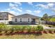 The home's fenced in backyard includes a pool and patio with tasteful landscaping at 8058 Corkfield Ave, Orlando, FL 32832