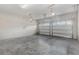 View of the home's spacious and clean two-car garage with painted walls and concrete floor at 8058 Corkfield Ave, Orlando, FL 32832