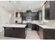Well-appointed kitchen with stainless steel appliances, island, and modern fixtures at 8058 Corkfield Ave, Orlando, FL 32832