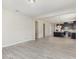 Open-concept living space with view of modern kitchen, showcasing spaciousness and design at 8058 Corkfield Ave, Orlando, FL 32832