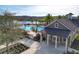 Community pool area with a lakeside view, comfortable lounge chairs, and a charming clubhouse at 8058 Corkfield Ave, Orlando, FL 32832