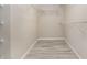 Walk-in closet with wood-look flooring and wire shelving for organization and storage at 8058 Corkfield Ave, Orlando, FL 32832