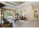 Light-filled living room with stylish furnishings, access to the outdoor pool area, and elegant decor at 9138 Pinnacle Cir, Windermere, FL 34786