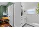 Bright bathroom with modern fixtures, stylish sink, and an adjacent office area at 1017 Florida Ave, St Cloud, FL 34769