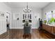 Elegant dining room with a stylish chandelier, built-in cabinet, and modern decor at 1017 Florida Ave, St Cloud, FL 34769