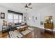 Bright living room with large windows, stylish decor, and comfortable seating at 1017 Florida Ave, St Cloud, FL 34769
