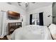 Bright bedroom with large window, view of TV, and ensuite bath at 1017 Florida Ave, St Cloud, FL 34769