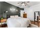 Cozy bedroom with dark walls and hardwood flooring, lots of natural light at 1017 Florida Ave, St Cloud, FL 34769