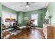 Spacious office room with hardwood floors and multiple workstations at 1017 Florida Ave, St Cloud, FL 34769