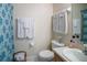 Clean bathroom featuring a toilet, sink, mirror, and a shower with a blue patterned curtain at 127 Lake Emma Cove Dr # 127, Lake Mary, FL 32746