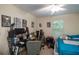 Bedroom featuring desk and bed with ceiling fan and posters at 127 Lake Emma Cove Dr # 127, Lake Mary, FL 32746