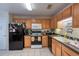 Functional kitchen with appliances, ample countertop space and lighting, ready for your culinary creations at 127 Lake Emma Cove Dr # 127, Lake Mary, FL 32746