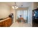 Cozy kitchen area with a table and chairs, perfect for casual dining, complemented by natural light at 127 Lake Emma Cove Dr # 127, Lake Mary, FL 32746