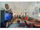 Open-concept living space with vaulted ceilings, blending comfort and style, perfect for modern living at 127 Lake Emma Cove Dr # 127, Lake Mary, FL 32746