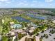 Extensive aerial perspective of a community with pools, lakes, lush landscaping, and common areas at 2009 Tropical Palms Cir, Kissimmee, FL 34747