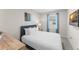 Comfortable bedroom featuring a well-lit space, sleek decor, and a large window at 2009 Tropical Palms Cir, Kissimmee, FL 34747