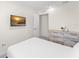 Bright bedroom boasts a dresser, mounted TV, and neutral tones for a relaxing atmosphere at 2009 Tropical Palms Cir, Kissimmee, FL 34747