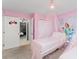 Adorable bedroom featuring princess murals, pink accents and an open doorway to a Star Wars themed bedroom at 2009 Tropical Palms Cir, Kissimmee, FL 34747