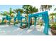 Poolside cabanas with turquoise curtains, lounge chairs, and privacy for relaxing by the water at 2009 Tropical Palms Cir, Kissimmee, FL 34747
