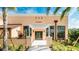 Well-manicured landscaping frames the inviting entrance to the fitness center at 2009 Tropical Palms Cir, Kissimmee, FL 34747