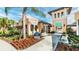 Resort's exterior with colorful landscaping and building facade at 2009 Tropical Palms Cir, Kissimmee, FL 34747