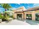 Charming building exterior with seating and well maintained landscaping at 2009 Tropical Palms Cir, Kissimmee, FL 34747