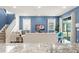 Comfortable living room featuring neutral tones, large windows for natural light, and a view of the open staircase at 2009 Tropical Palms Cir, Kissimmee, FL 34747